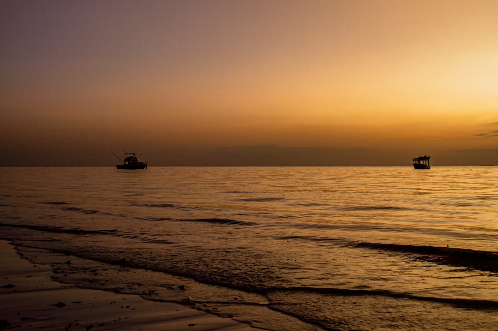 Traditional boats on the water near a Kenya coast hotel